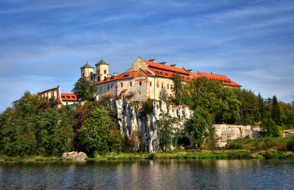 Vistula River view with the Benedictine Abbey in Tyniec – scenic riverside landscape with historic monastery visible on the hill