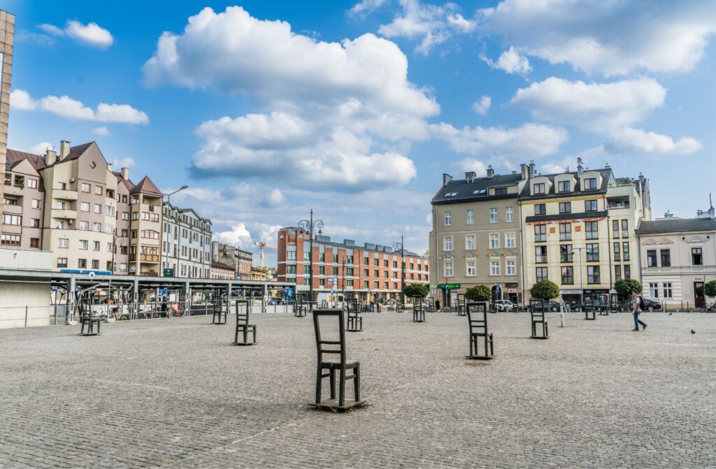 Ghetto Heroes Square in Krakow with memorial chairs symbolising the former Jewish ghetto and open urban space.
