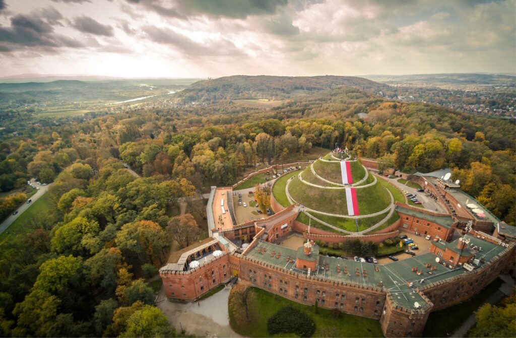 Kościuszko Mound from above – aerial view of the historic mound in Krakow, surrounded by greenery and cityscape