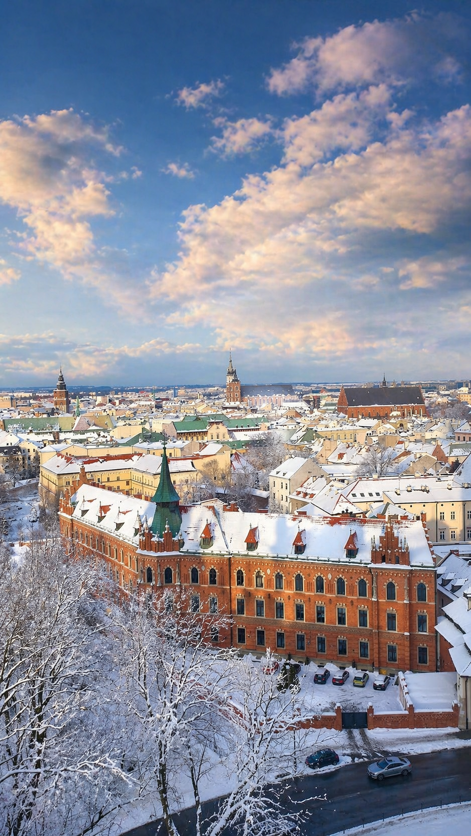 Itinerary: View over Krakow from the Wawel Cathedral tower with historic rooftops and church towers.