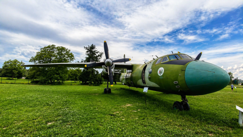 Aircraft exhibit at the Polish Aviation Museum in Krakow with a historic military plane displayed outdoors