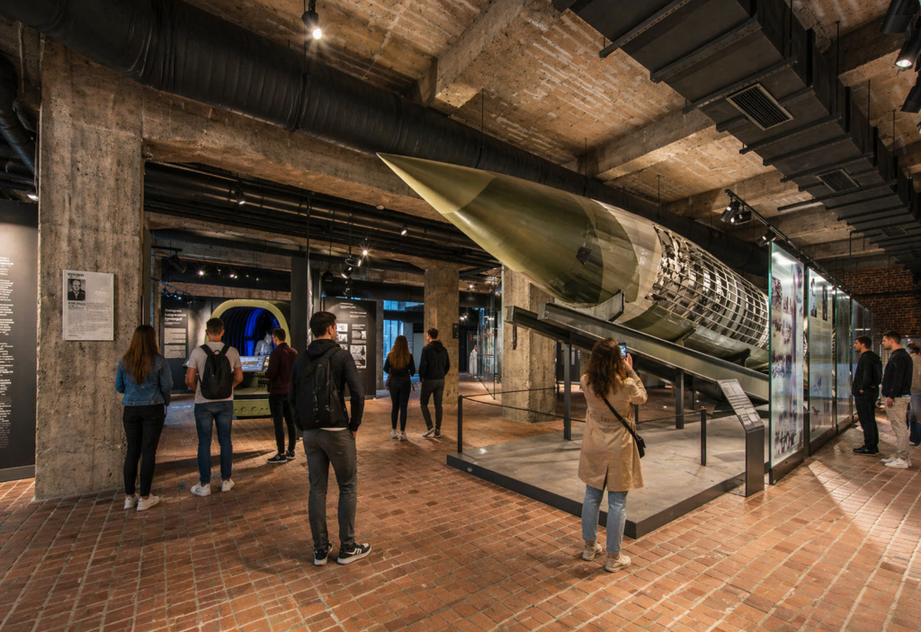 Home Army Museum in Krakow – modern exhibition hall with missile display and visitors exploring historical exhibits