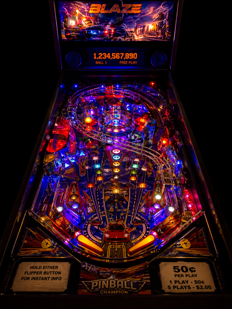 Neon-lit pinball machine in a dark arcade setting, with colorful lights and glowing playfield creating a vibrant retro gaming atmosphere