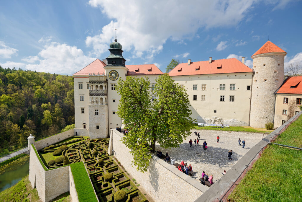 Pieskowa Skała Castle in Ojcow National Park surrounded by limestone cliffs and forest landscape